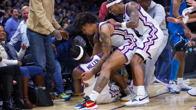 TCU basketball team celebrating after buzzer beater three-pointer